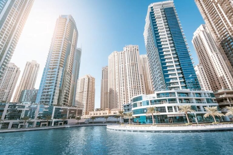 High-rise Dubai skyline behind Islamic finance documents symbolizing Binghatti sukuk success.”