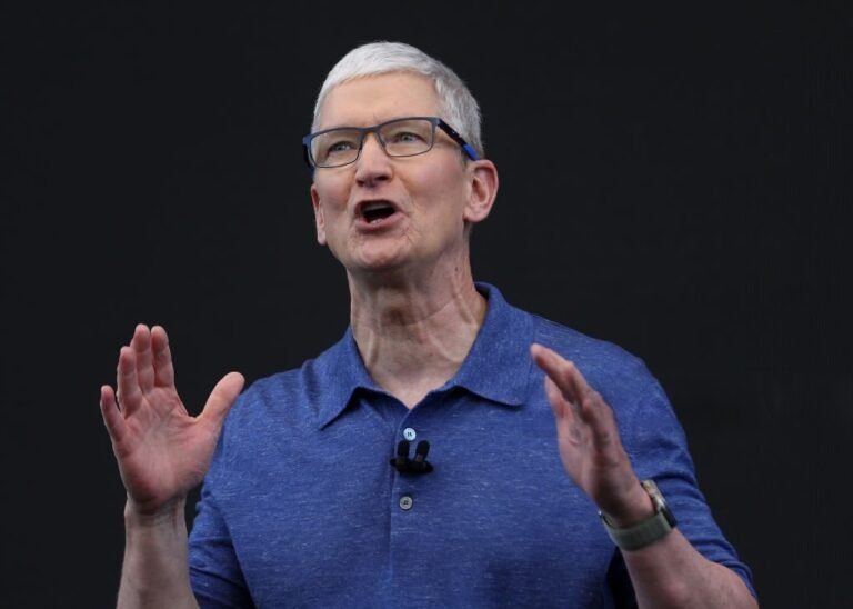 Tim Cook speaking at Apple’s developer conference, emphasizing AI-driven innovation