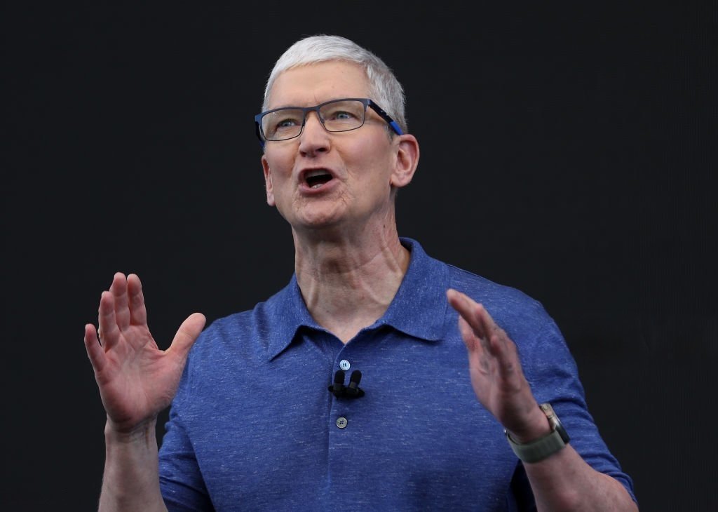 Tim Cook speaking at Apple’s developer conference, emphasizing AI-driven innovation