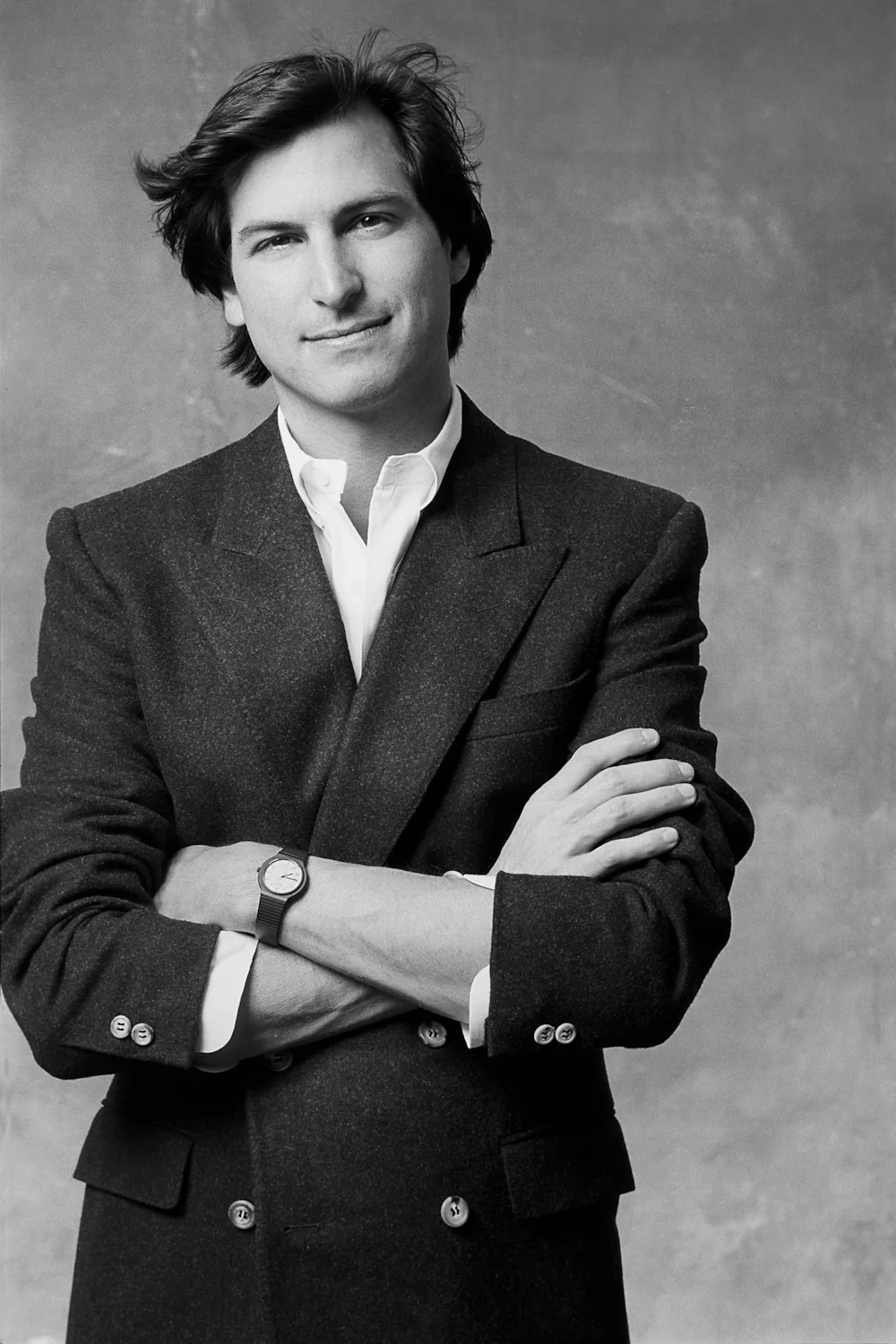 Steve Jobs presenting the iPhone, symbolizing his visionary leadership and entrepreneurial legacy in technology.
