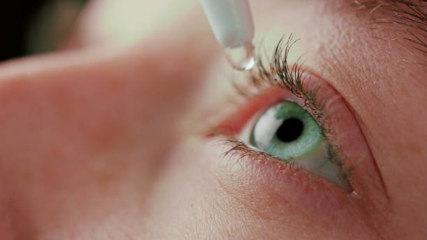 Eye drops and reading glasses representing treatment option for presbyopia and near vision improvement.