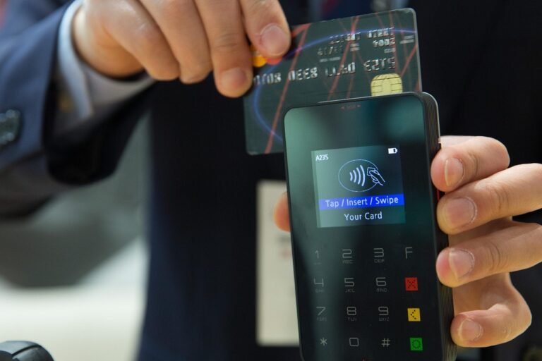 “Person using a smartphone for contactless digital payment, symbolizing the future of digital transactions.”