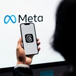 Meta logo with AI digital graphics representing the Manus acquisition.