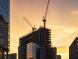 Private Credit Steps In Where Banks Won't in Real Estate 17 Commercial property development under construction, representing private credit real estate financing