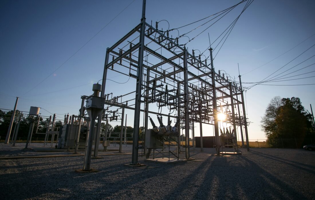 The Bottleneck Behind the Bottleneck: How a Copper and Transformer Shortage Is Reshaping the AI Boom 16 Data center transformer shortage: a high-voltage electrical substation with transformers and switchgear silhouetted at sunset.